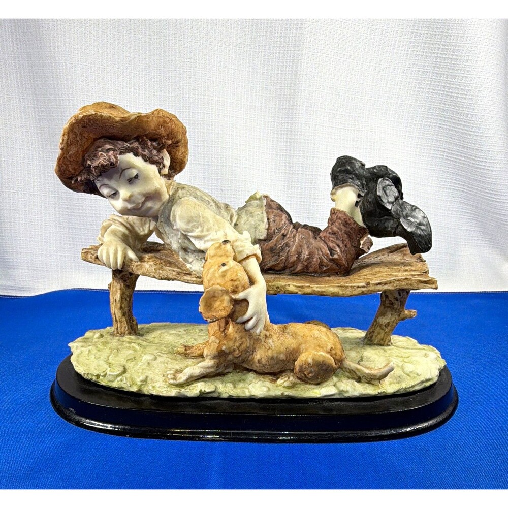 Americana "Stay With Me" Reclining Boy with Dog Figurine.